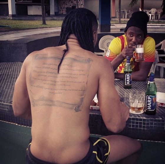 Flavour shows off Bold Artistic Tattoo on His Back | BellaNaija
