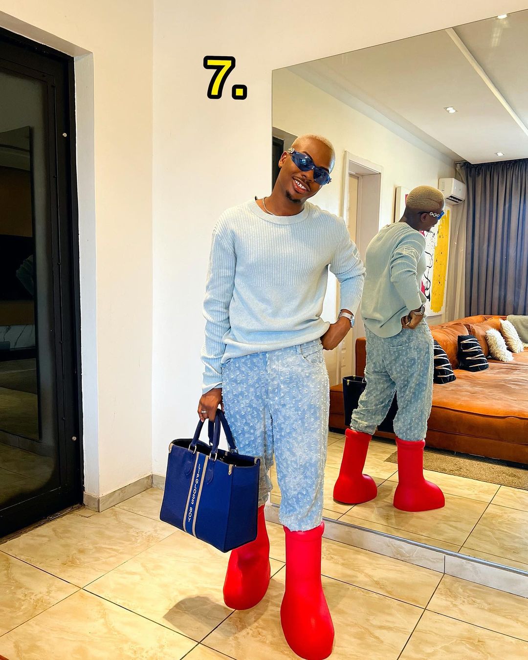How To Wear MSCHF's Viral Big Red Boots - 9 Lessons From Eni Adeoluwa |  BellaNaija